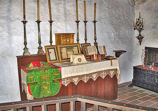 altar with scriptures and candles