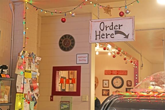 hanging sign that reads "order here"